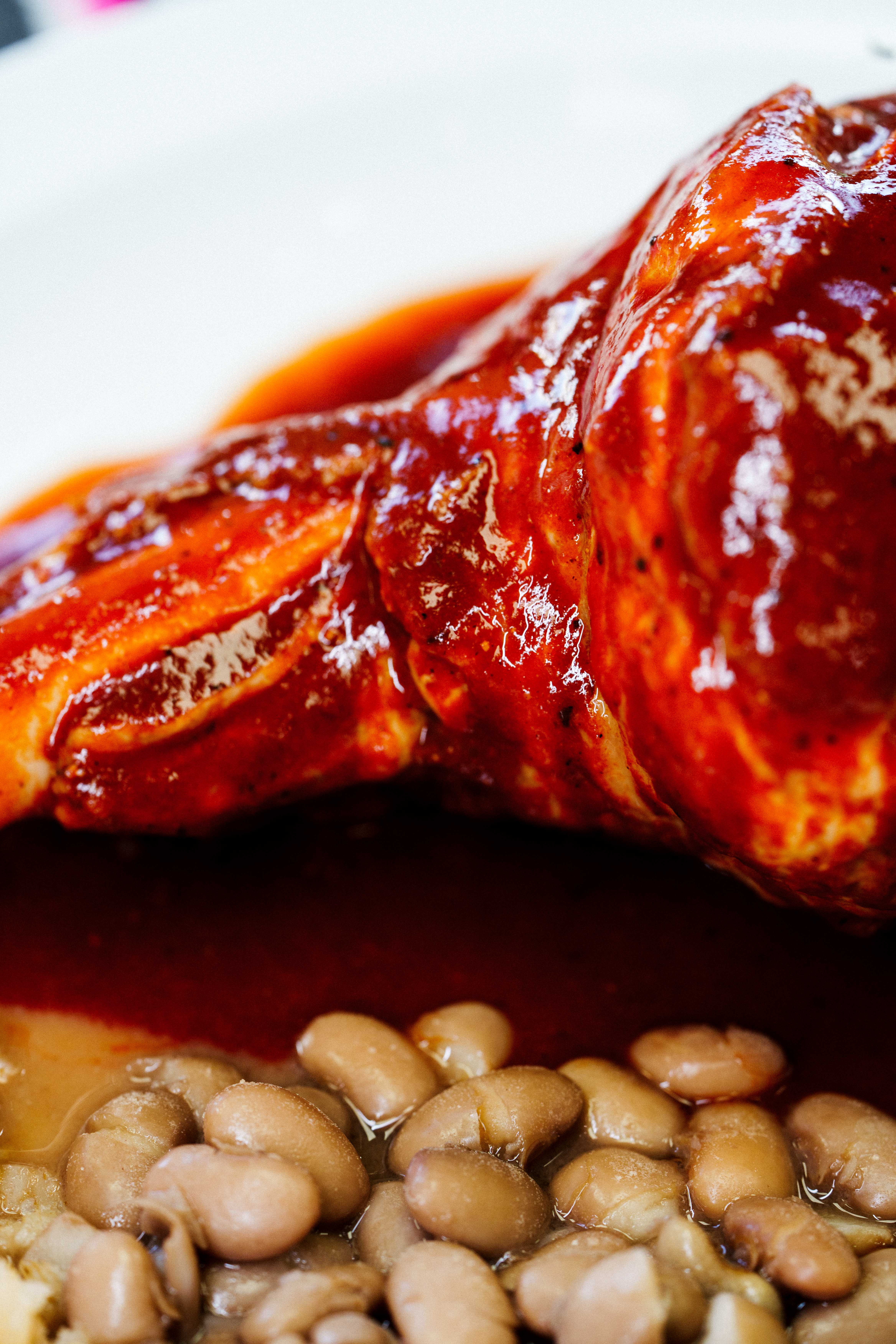 Chamorro de Borrego — lamb shank in red sauce with rice and beans