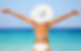 Beach summer holidays woman in happy freedom concept with arms raised out in happiness. Wo