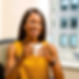 attractive black woman smiling with coffee mug