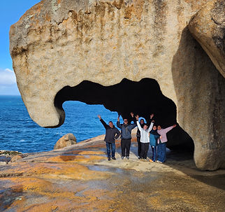 Group posing under Eagle Rock, Remarkable Rocks, Flinders Chase National Park on a Kangaroo Island tour