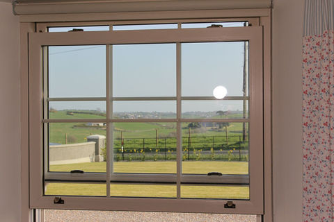 sash window with a stunning countryside view