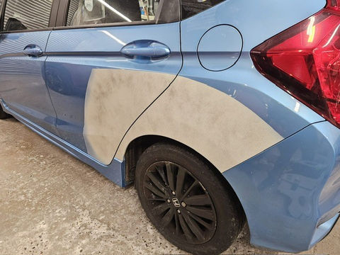 Blue car with primer panel repair, quarter panel damage, Shepperton Body Works Ltd.