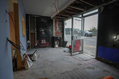 Entrance area of retail store undergoing interior electrical overhaul and renovation