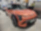 Orange Kia EV6 car, DV26 ZTP number plate, in a workshop setting. Shepperton Body Works Ltd
