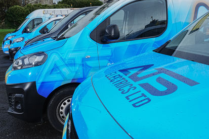 Front quarter view of blue ATS Electrics company service van