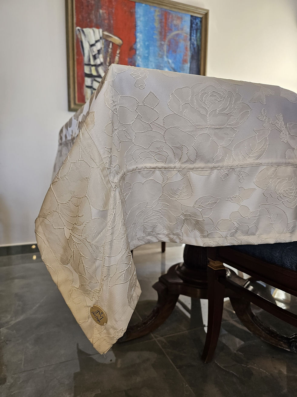 Thumbnail: Off-white patterned tablecloth with emblem