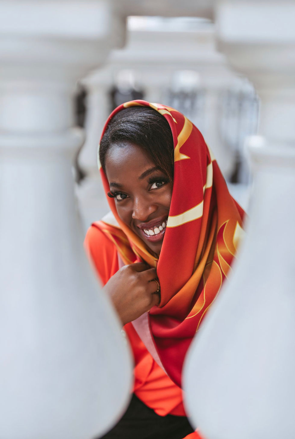 Thumbnail: woman wearing ethnoluxury red gold flame silk scarf