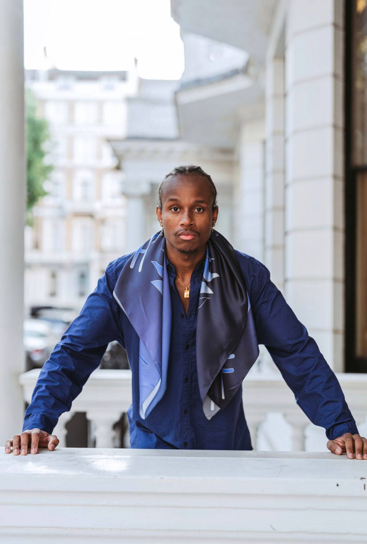 man wearing luxury blue flame silk scarf