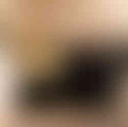 Image of three partygoers posing in front of the gift table at the Fanfare gala.