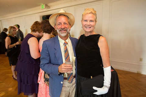 Image of two partygoers posing together in the Great Room at the Mad Men gala.