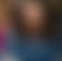 Image of a woman wearing a blue lace dress.