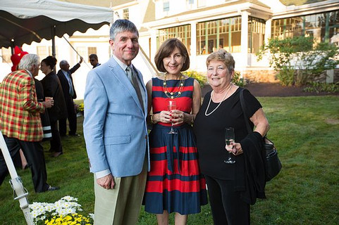 Image of three partygoers posing outside at the Mad Men gala.