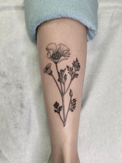 Black and grey flower tattoo