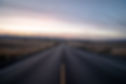 shot-highway-road-surrounded-by-dried-grass-fields-sky-sunset.jpg