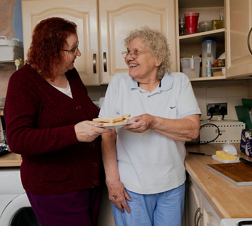 two women standing in a kitchen next to each other_edited_edited.jpg