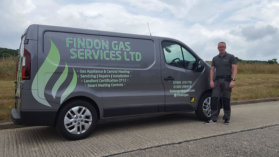 Justin Redman standing infront of Findon Gas Services van