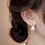 Thumbnail: Elegant Mother of Pearl Hoop Earrings with Crystal Accents - Chic Everyday Jewel