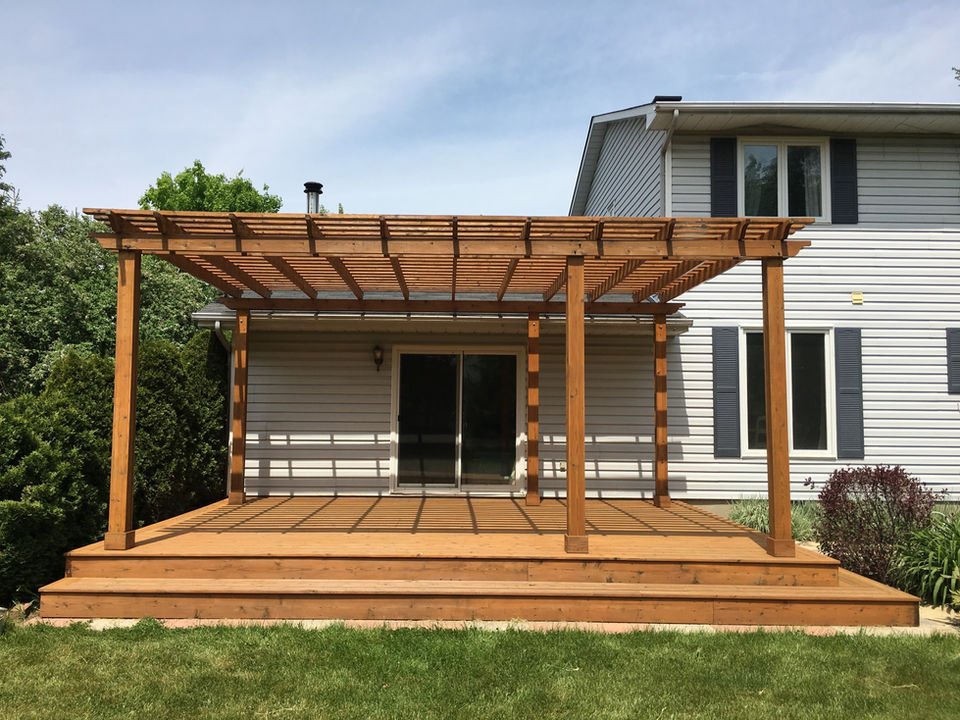 A revival of a back deck and pergola from a thorough cleaning and stain application - after image