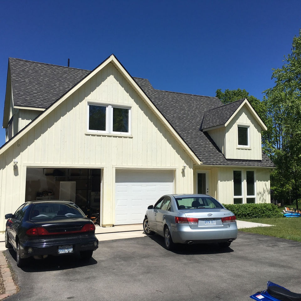 Full exterior painting project for siding - before image.
