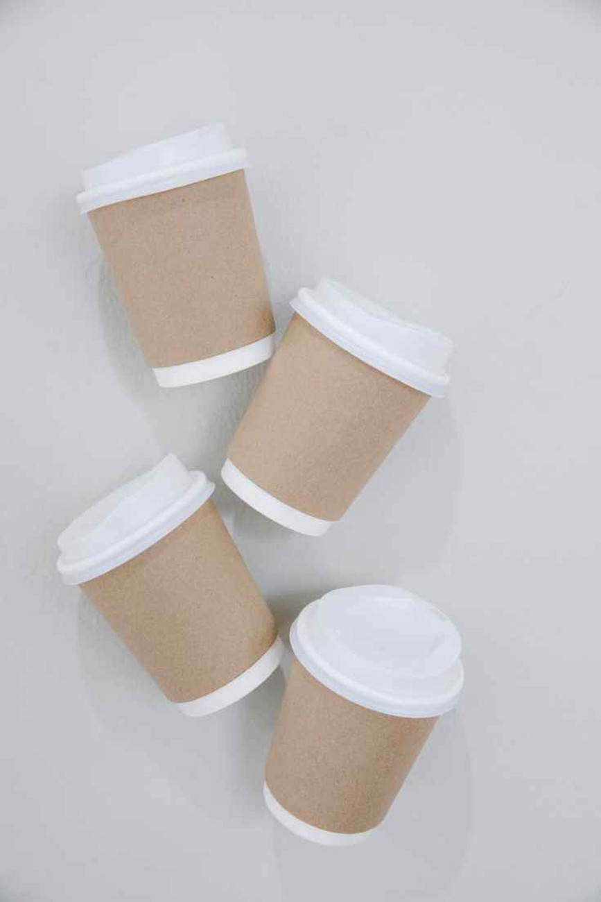 paper cups of coffee on table
