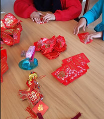 Kids learning to make Chinese lanterns