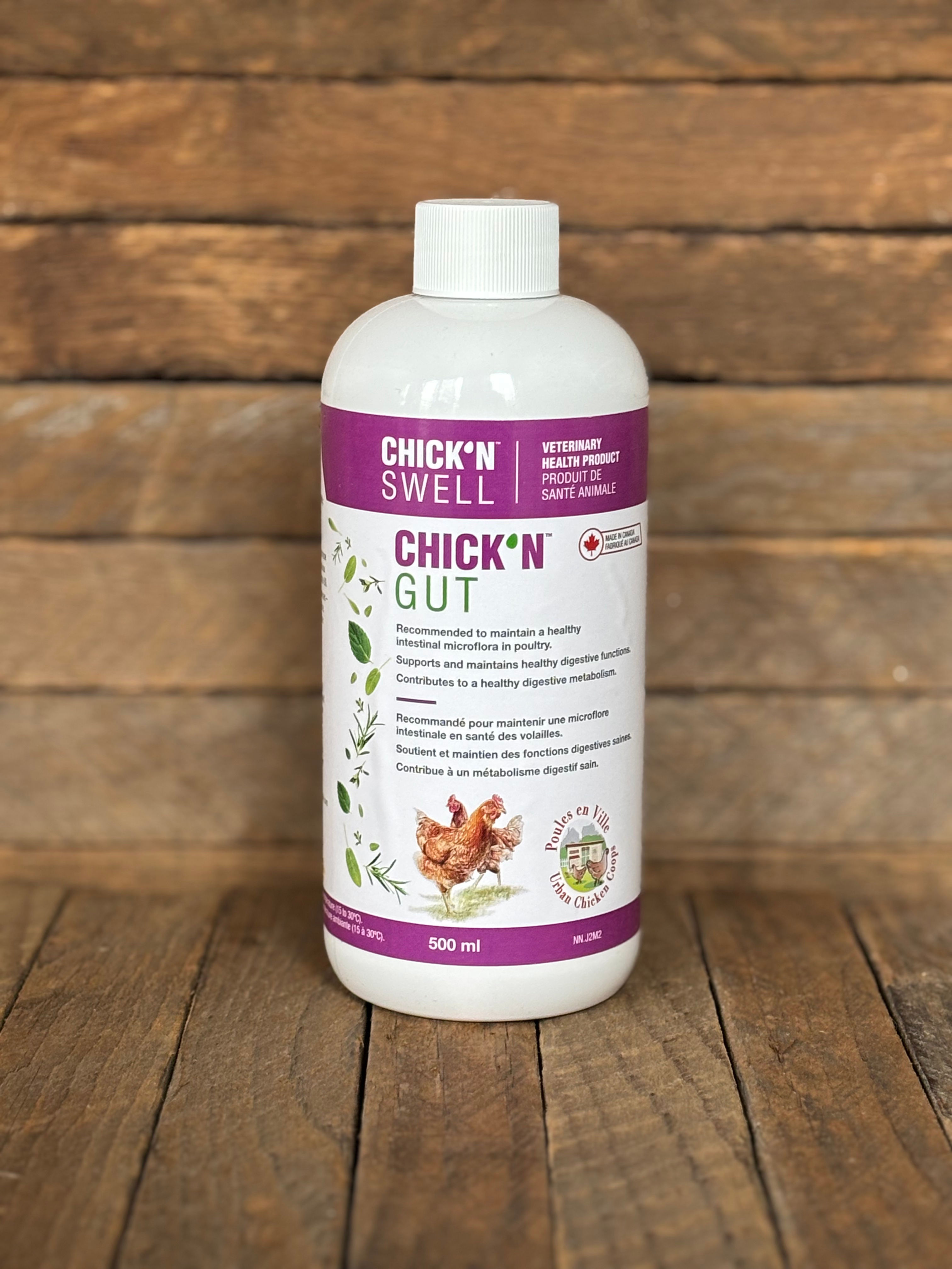 A bottle of digestive poultry supplement with wooden background