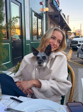Sally Rychlak holding small dog 