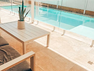 Stylish backyard pool with custom tiling and timber outdoor setting – SCX Projects