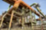 metal-pipes-structures-with-clear-blue-sky_181624-14947.webp