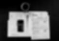 black Android smartphone near ballpoint pen, tax withholding certificate on top of white f