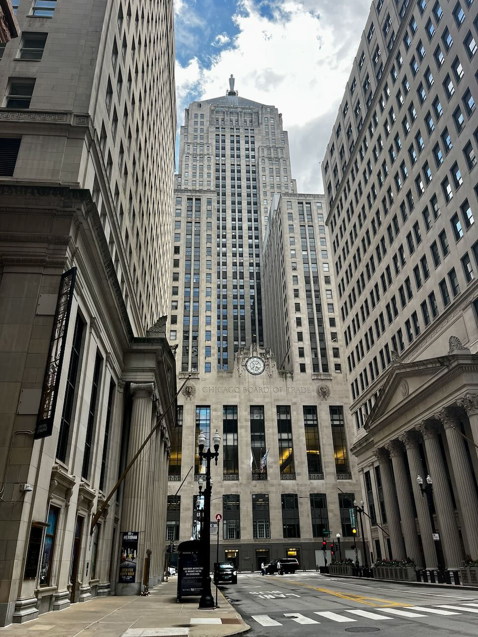 The Chicago Board of Trade building is a 44-story, 604-foot Art Deco skyscraper located in the Chicago Loop, standing at the foot of the LaSalle Street "canyon".
