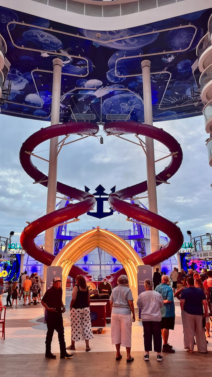 The slide ended at deck 6 where there was a sports bar, carousel and hot dog eatery. At the back was the outdoor theater for the water show.