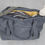 Thumbnail: Big bag in grey and yellow filled with towels and toys, great family bag and change bag