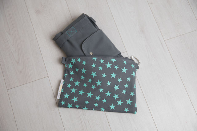 foldaway grey travel bag in turquoise star print bag