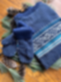 Navy and treal birds eye patterned sweater and matching mittens.