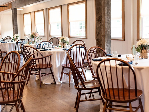 Tables set up for a wedding in the York Room at Fosters Clambakes and Catering