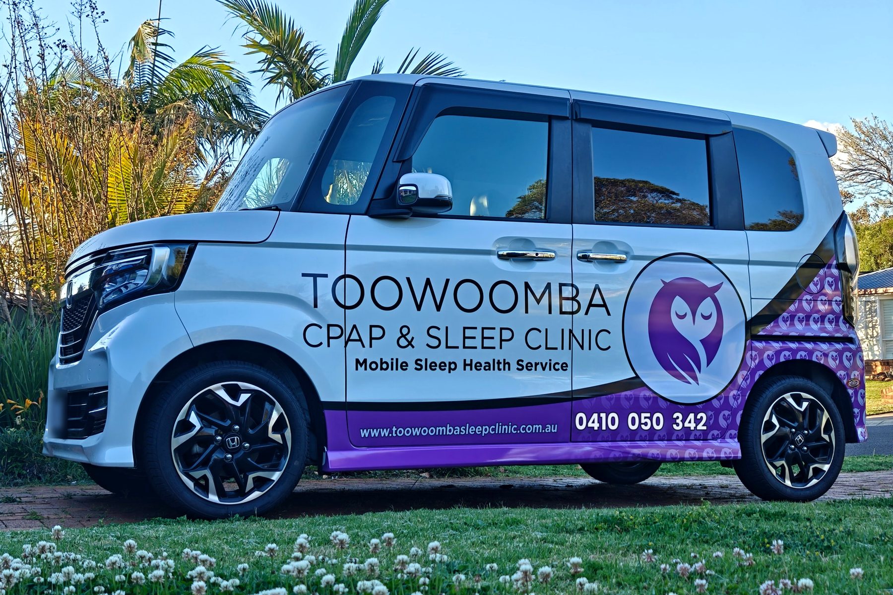 The Toowoomba CPAP and Sleep Clinic car, a white van with purple owl branding