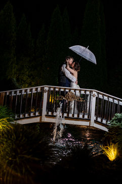 Bride and Groom under umbrella, Bride and Groom in rain under umbrella 
