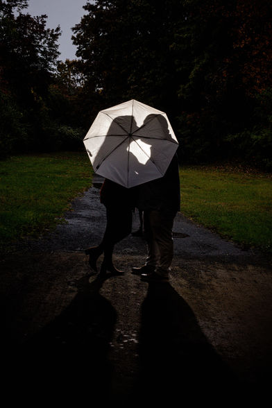 umbrella silhouette of couple kissing