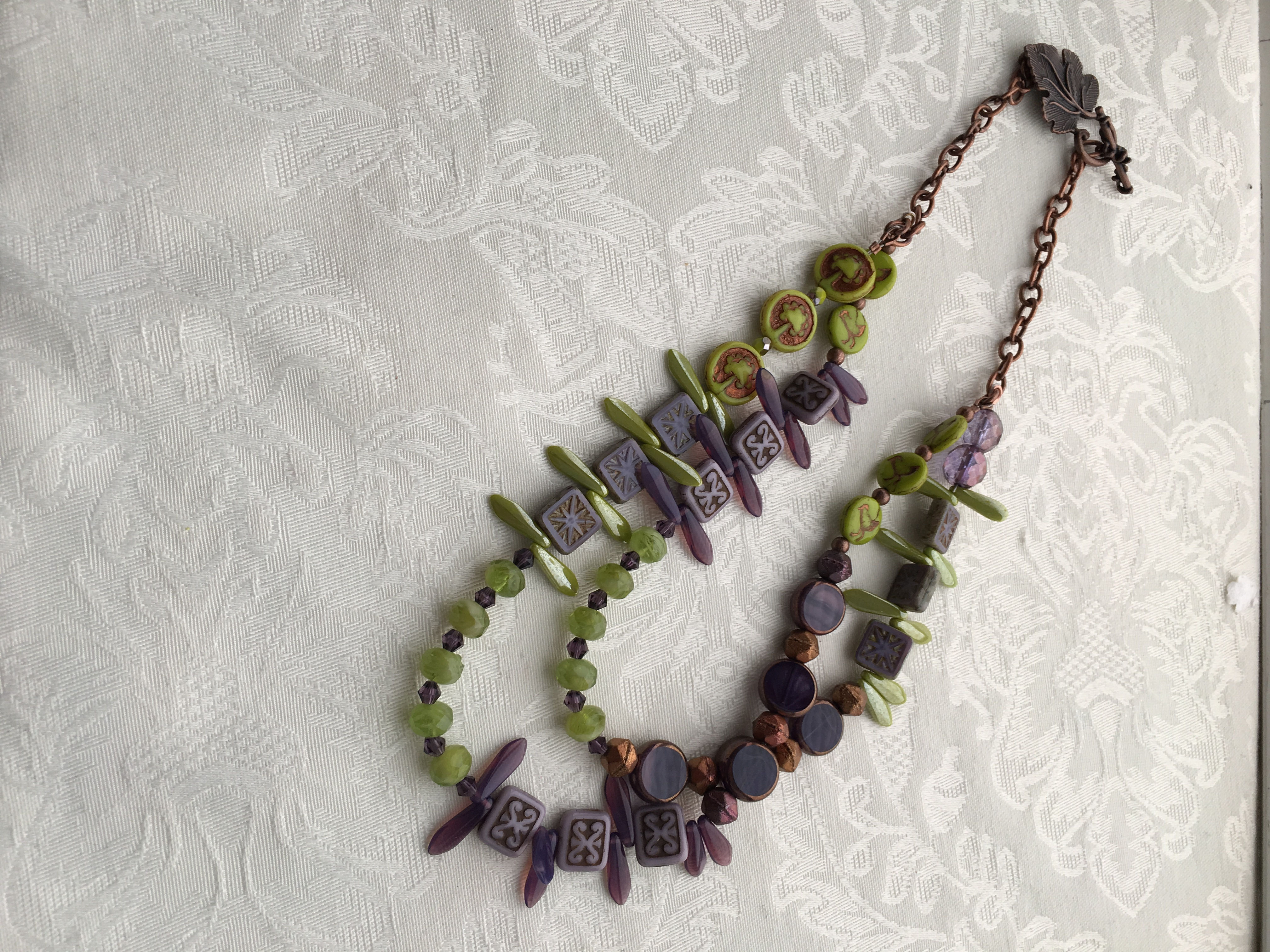 Purple grapes and green leaves necklace