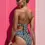Thumbnail: Model wears Geometric Noir  Bandeau Bikini and High Leg Bikini Set back view