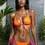 Thumbnail: Model wearing orange and pink colour block triangle bikini set, front view.