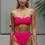 Thumbnail: Model wears Pink Pop Polka Dot strapless Bandeau Bikini Top with high leg bottom front view