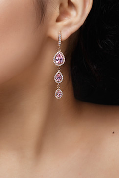 long-earring-with-violet-precious-stones-hang-from-woman-s-ear.jpg