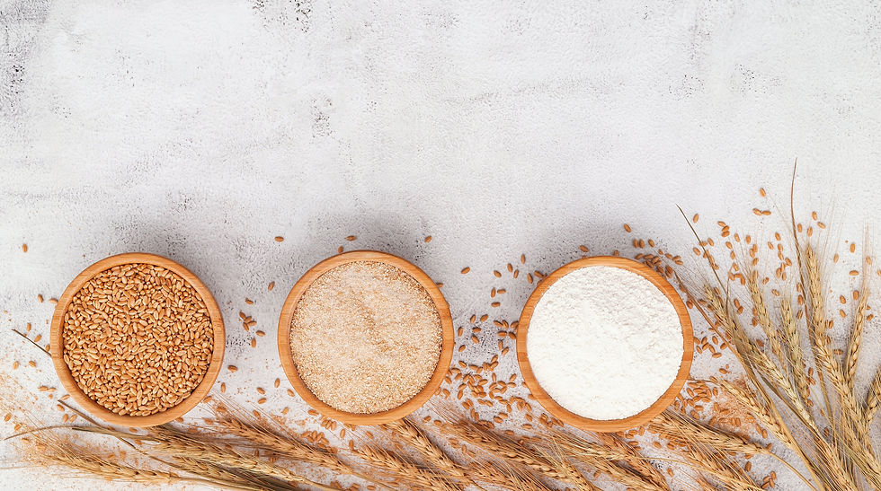 Wheat grains , brown wheat flour and white wheat flour in wooden bowl set up on white conc
