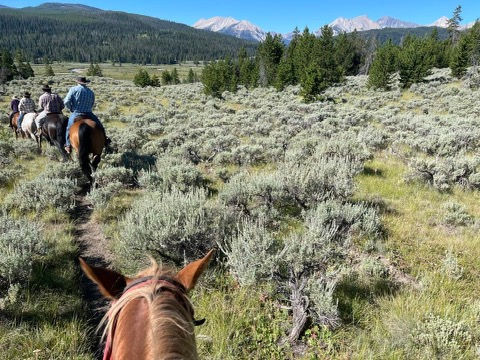 Trail riding with Big Sky in the distance