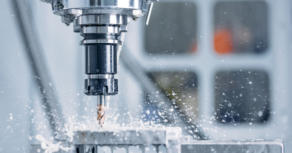 A close-up of a working CNC industrial machine is rotating and cutting hard metal. Sparks are flying.