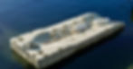 A white modular plastic floating dock is anchored near the shoreline in calm water under a sunny sky.