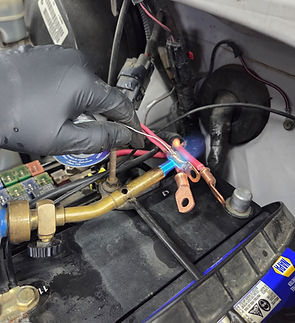 Splicing wires together using fire.