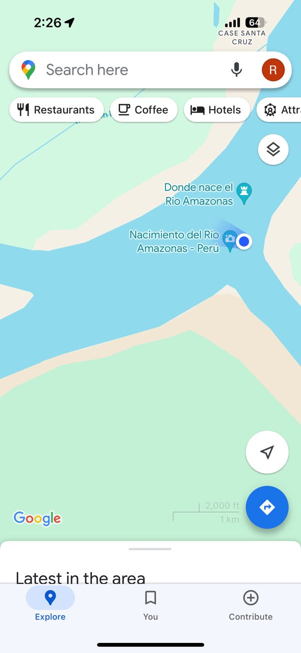 Map interface showing the Nacimiento del Río Amazonas in Peru. Blue river on green terrain. Search and place icons visible.